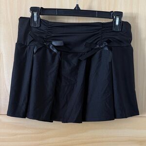 Spencer's Black Pleated Mini Skirt with Dual Bow Detail
